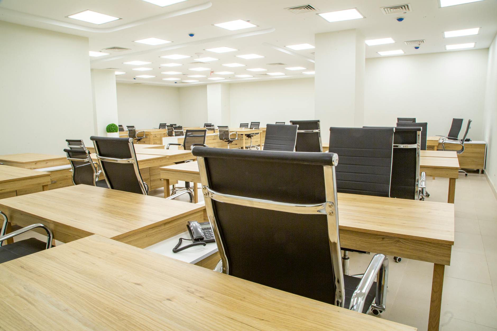 A modern, well-lit executive office suite in Nairobi CBD, featuring premium furniture and city views.