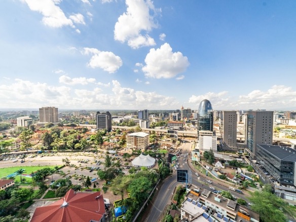 Modern executive office interior in Nairobi with sleek desks, ergonomic chairs, and city skyline view, embodying premium offi