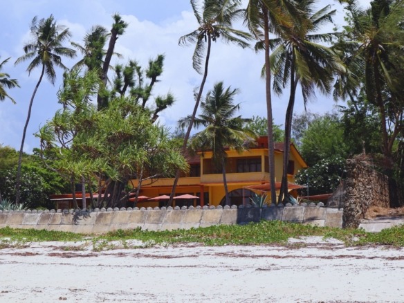 Aerial view comparing luxury Mombasa properties on North and South Coast beaches.