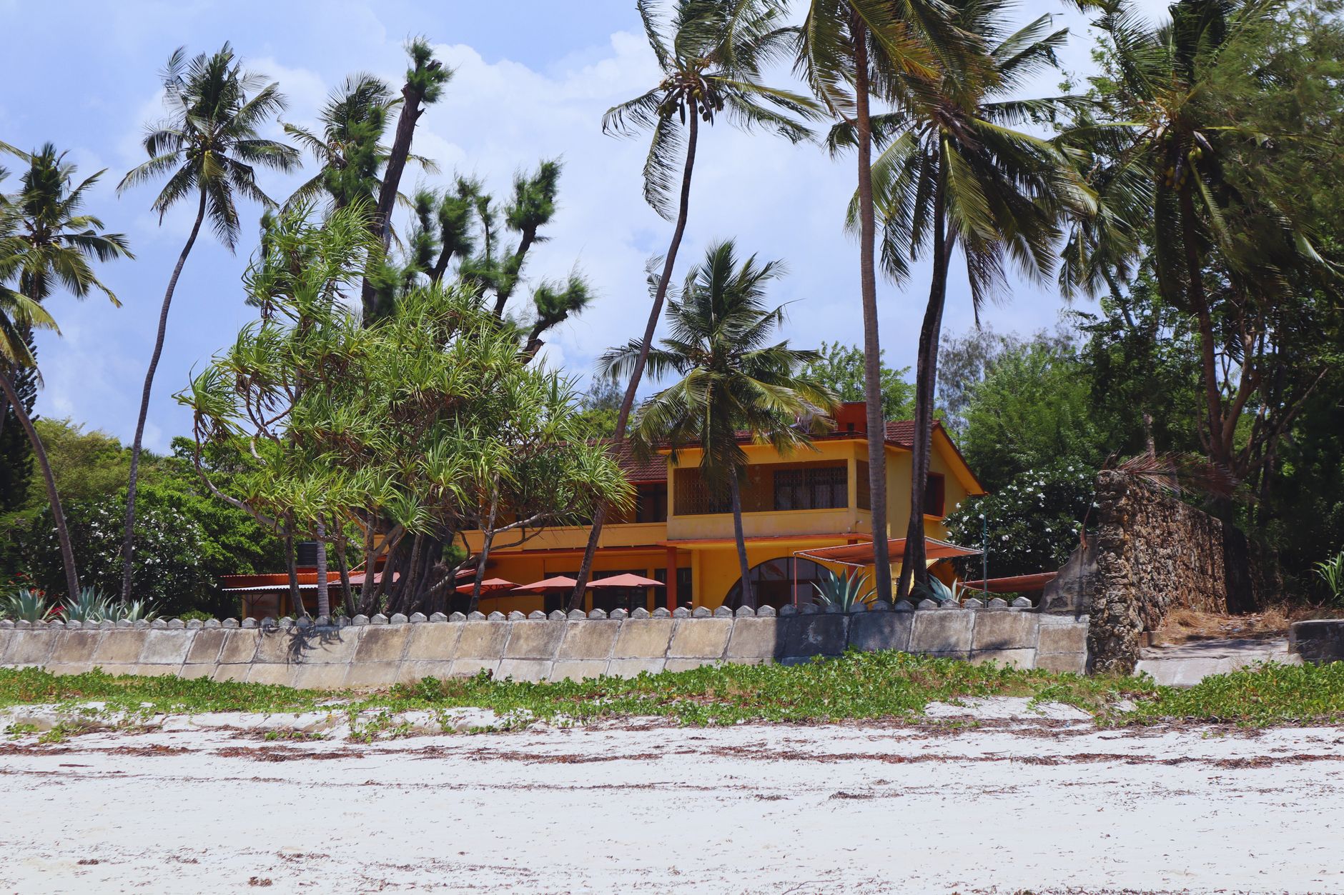 Aerial view comparing luxury Mombasa properties on North and South Coast beaches.